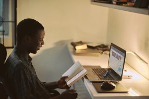 African male doing online learning courses